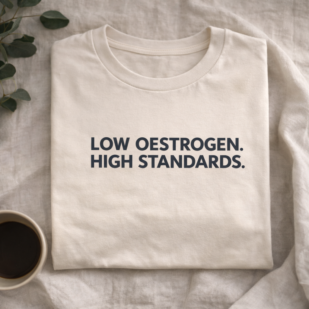 Low Oestrogen High Standards T-Shirt – Funny Menopause Tee, Perimenopause Humor Shirt, Women’s Hormone Humor Graphic Tee, Minimalist Women’s Statement T-Shirt