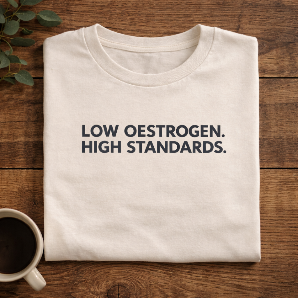 Low Oestrogen High Standards T-Shirt – Funny Menopause Tee, Perimenopause Humor Shirt, Women’s Hormone Humor Graphic Tee, Minimalist Women’s Statement T-Shirt